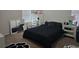 Bedroom featuring a large mirror and white cabinet for storage and decorations at 320 Aberdeen Dr, Davenport, FL 33896
