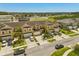 Aerial view of townhomes boasting manicured landscaping, ample parking, and well-maintained exteriors in a beautiful community at 3610 Rodrick Cir, Orlando, FL 32824