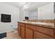 Bathroom with double sink vanity, tile flooring, and framed mirror at 3610 Rodrick Cir, Orlando, FL 32824