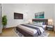 Bedroom featuring a bed with stylish gray and white bedding and modern nightstands at 3610 Rodrick Cir, Orlando, FL 32824