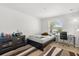 Modest bedroom with striped rug, desk, and bed at 3610 Rodrick Cir, Orlando, FL 32824
