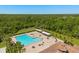 Aerial shot of a large community pool area with sun loungers and covered seating at 3610 Rodrick Cir, Orlando, FL 32824