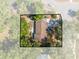 An aerial view of the property shows the entire lot surrounded by mature trees at 412 Noya Ln, Apopka, FL 32712