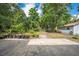 Backyard with potted plants and a storage building provides an ideal garden or play space at 412 Noya Ln, Apopka, FL 32712