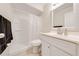 Clean bathroom featuring a shower, vanity, mirror, and commode at 412 Noya Ln, Apopka, FL 32712
