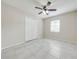 Bright bedroom featuring tile floors, a ceiling fan, and a double door closet at 412 Noya Ln, Apopka, FL 32712