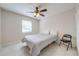 Well lit bedroom with tile floors, ceiling fan, and a window at 412 Noya Ln, Apopka, FL 32712