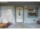 Close-up of the front door with decorative glass and visible house number, framed by painted trim at 412 Noya Ln, Apopka, FL 32712