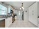 Spacious kitchen with ample storage, granite counters, tiled backsplash and modern stainless steel appliances at 412 Noya Ln, Apopka, FL 32712