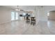 Spacious eat-in kitchen with tile flooring, white cabinets, and stainless steel appliances at 412 Noya Ln, Apopka, FL 32712