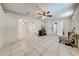 Spacious living room featuring tile floors, ceiling fans, and an open layout at 412 Noya Ln, Apopka, FL 32712