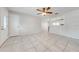 Bright living room featuring tile flooring, ceiling fan, and view to other rooms at 412 Noya Ln, Apopka, FL 32712