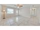 Bright living room featuring tile flooring, ceiling fan, and a neutral color scheme at 412 Noya Ln, Apopka, FL 32712