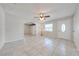 Bright living room with tile flooring, ceiling fan, and view to other rooms at 412 Noya Ln, Apopka, FL 32712