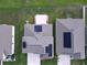 A bird's eye view of the roofs with solar panels of a home at 4190 Bull St, St Cloud, FL 34772