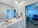 Bathroom featuring double vanity, framed mirror, and shower at 4190 Bull St, St Cloud, FL 34772