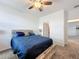 Bedroom featuring a ceiling fan, natural light, and an en-suite bathroom at 4190 Bull St, St Cloud, FL 34772