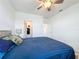Bedroom with ceiling fan, access to en-suite and walk-in closet providing ample space at 4190 Bull St, St Cloud, FL 34772