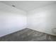 A bedroom with carpeted floors and neutral walls provides a blank canvas at 4190 Bull St, St Cloud, FL 34772