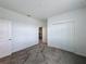 This bedroom features a closet and plush carpeting for a comfortable and inviting space at 4190 Bull St, St Cloud, FL 34772