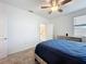 Bedroom featuring a ceiling fan, natural light, and an en-suite bathroom at 4190 Bull St, St Cloud, FL 34772
