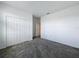 A bedroom featuring plush carpeting, a closet, and a doorway leading to another room at 4190 Bull St, St Cloud, FL 34772