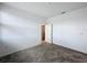 Bedroom featuring carpet flooring and access to another room via a door at 4190 Bull St, St Cloud, FL 34772