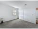 Bedroom featuring carpet flooring, a double window, and a closet at 4190 Bull St, St Cloud, FL 34772