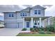 Beautiful two-story home with a two-car garage, covered porch, and well-maintained landscaping at 4190 Bull St, St Cloud, FL 34772