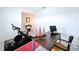 Home office featuring a computer, decorative model boats, and a Peloton exercise bike at 4190 Bull St, St Cloud, FL 34772