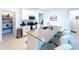 Bright kitchen featuring an island with seating and a convenient walk-in pantry at 4190 Bull St, St Cloud, FL 34772