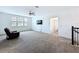 Bright upstairs living area with neutral carpet, ceiling fan, and ample windows at 4190 Bull St, St Cloud, FL 34772
