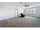 Bright upstairs living area with neutral carpet, ceiling fan, and ample windows at 4190 Bull St, St Cloud, FL 34772
