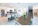 Open layout features a dining area, kitchen, and staircase, creating a seamless flow for entertaining and living at 4190 Bull St, St Cloud, FL 34772