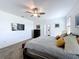 Spacious main bedroom with a ceiling fan, en-suite bathroom, and plenty of natural light at 4190 Bull St, St Cloud, FL 34772