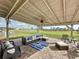 Covered outdoor patio with stylish seating overlooking an expansive yard at 4190 Bull St, St Cloud, FL 34772
