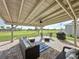 Covered outdoor patio with stylish seating overlooking an expansive yard at 4190 Bull St, St Cloud, FL 34772