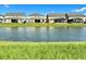 Backyard view with a pond and well-maintained lawns enhancing the appeal of these multi-Gathering homes at 5019 Down Ct, St Cloud, FL 34772