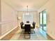 Open dining room filled with lots of light highlighting the decor, rug, and sliding glass door at 5019 Down Ct, St Cloud, FL 34772
