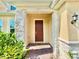 Inviting front entrance with stone accents and a brick walkway at 5019 Down Ct, St Cloud, FL 34772