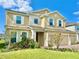 Inviting two-story home with manicured lawn and stone accents at 5019 Down Ct, St Cloud, FL 34772