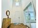 Bright foyer with high ceilings, wood floors, and elegant chandelier at 5019 Down Ct, St Cloud, FL 34772