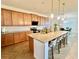 Gourmet kitchen with granite countertops, large island with seating, and modern appliances at 5019 Down Ct, St Cloud, FL 34772