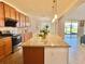 Bright kitchen with stainless steel appliances, granite countertops, and a large central island at 5019 Down Ct, St Cloud, FL 34772