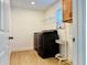 Laundry room with modern washer and dryer, storage and tiled floor at 5019 Down Ct, St Cloud, FL 34772