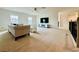 Spacious living room with neutral carpet, fan and plenty of natural light at 5019 Down Ct, St Cloud, FL 34772