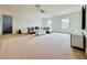 Spacious living room with neutral carpet, fan and plenty of natural light at 5019 Down Ct, St Cloud, FL 34772