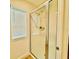 Bright, tiled shower with glass doors and window brings lots of natural light at 5019 Down Ct, St Cloud, FL 34772