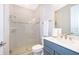 Well-lit bathroom equipped with a modern glass shower and contemporary fixtures, providing a clean, fresh feel at 5414 Log Grove Ln, Orlando, FL 32829