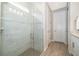 Stylish bathroom featuring a glass shower enclosure, offering a sleek and modern design at 5414 Log Grove Ln, Orlando, FL 32829